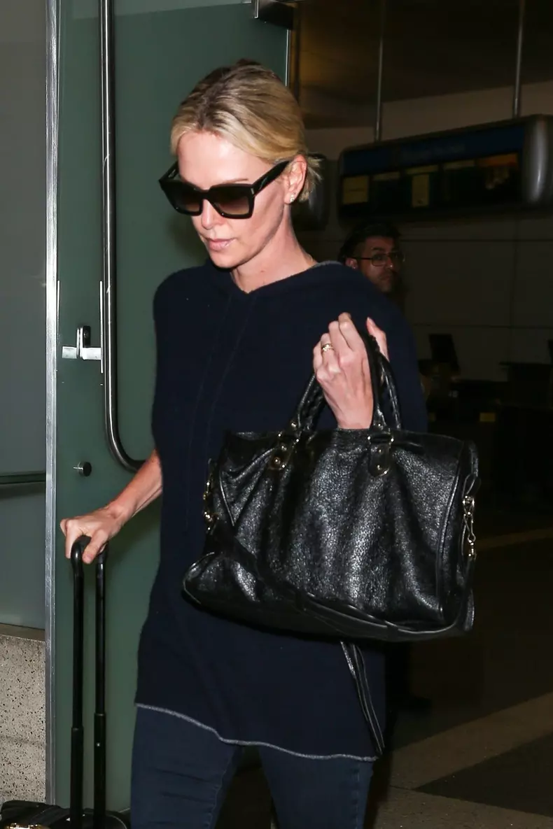 Charlize Theron lands at LAX after attending the International AIDS Conference