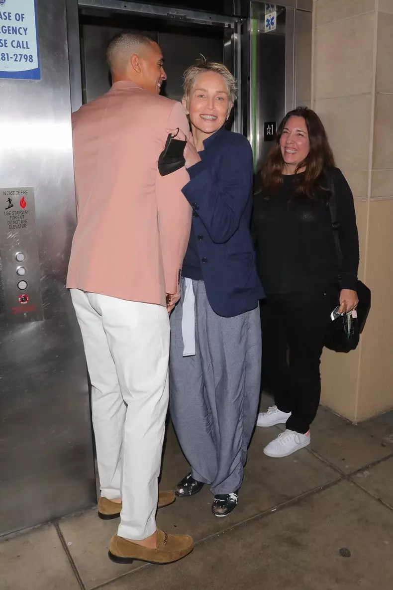 *EXCLUSIVE* Sharon Stone puts on a flirty display with a young handsome gentleman while spotted leaving dinner with a friend in Beverly Hills