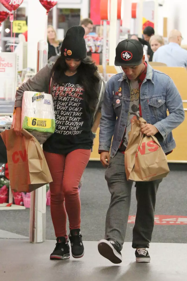 Camera shy Bruno Mars and his girlfriend Jessica Caban seen leaving a local drug store in Los Angeles