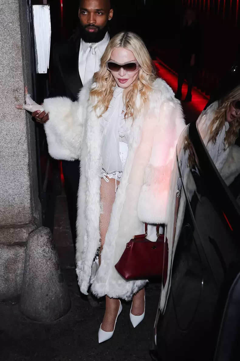 Milan, Italy. 28th Feb, 2026. Women's Fashion, Fall/Winter 2026/2027 - Dolce & Gabbana Party - Guest Arrivals. Pictured: Madonna (American singer-songwriter and actress), Akeem Morris (Jamaican soccer player and Madonna's boyfriend) Credit: Independent Ph