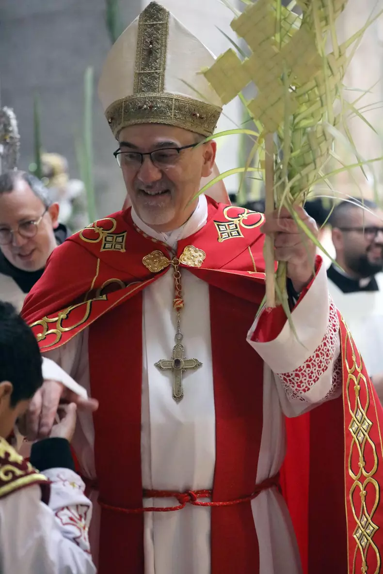 Jerusalem, Israel 13th April 2025 Monks marching with date palm branches during the Palm Sunday ceremony at the Church of the Holy Sepulchre.  Pierbattista Pizzaballa, Latin Patriarch of Jerusalem, marching among monks, waiving a date palm branch while bl