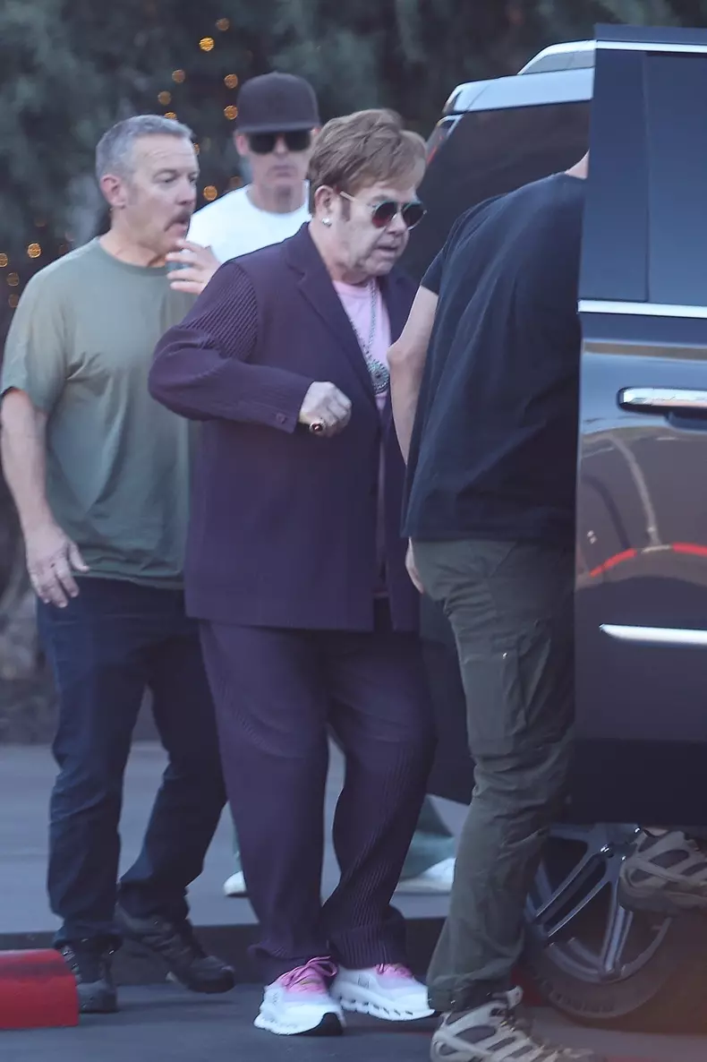 *EXCLUSIVE* Elton John Looks Frail as He’s Assisted to Car After Shopping at Maxfield in Los Angeles, CA