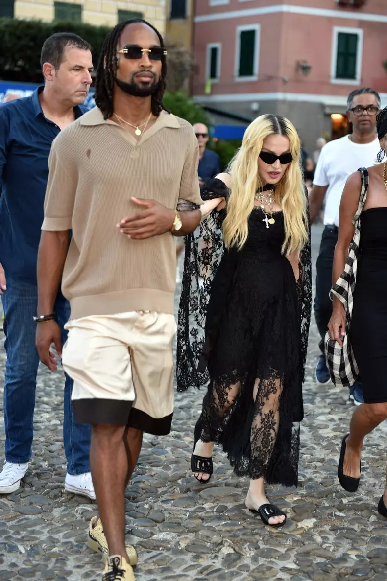 Madonna and her rumoured boyfriend Akeem Morris and a group of friends are pictured out and about in Portofino where they visited a church first before going for dinner at Punny restaurant.Madonna was wearing a D&G outfit.