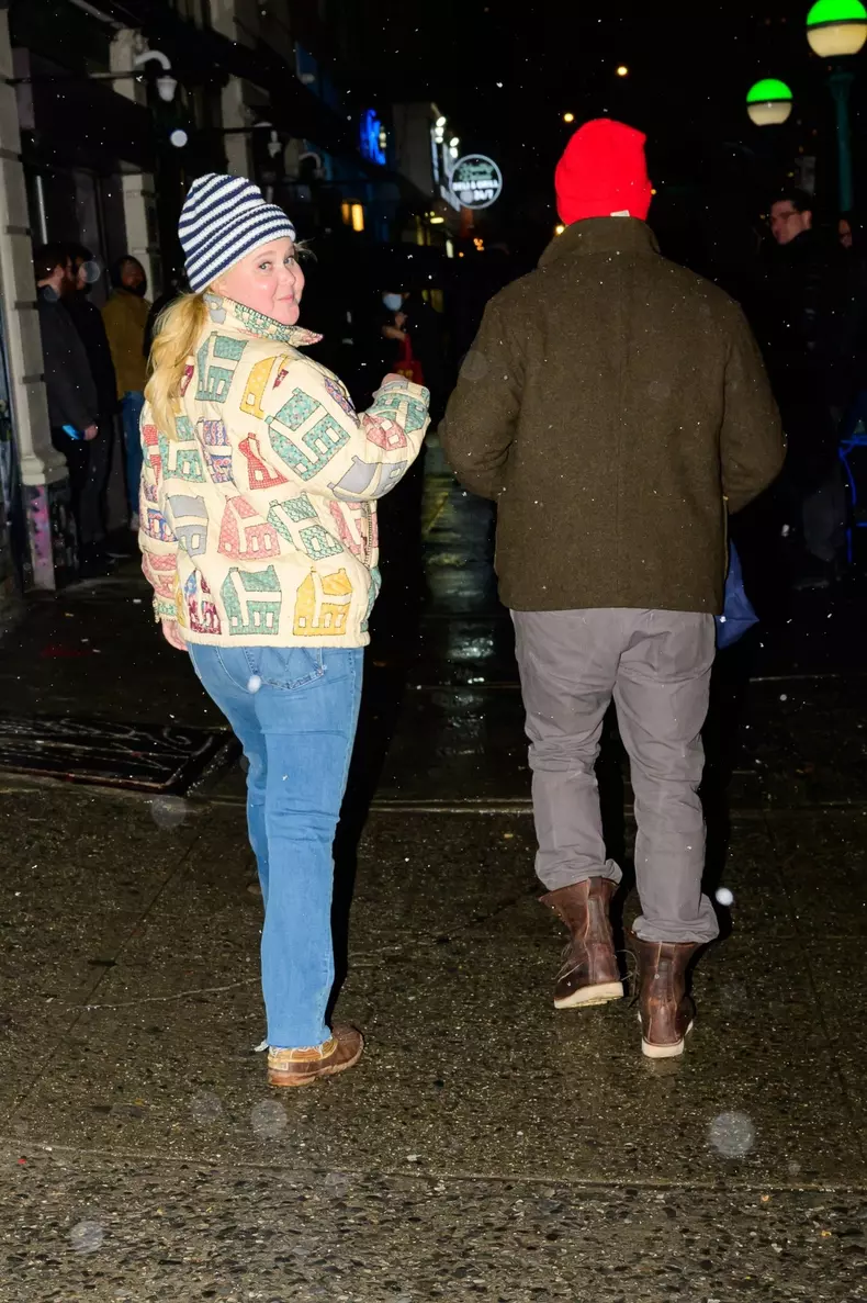 Amy Schumer and Chris Fischer leave after the Paul McCartney concert in New York
