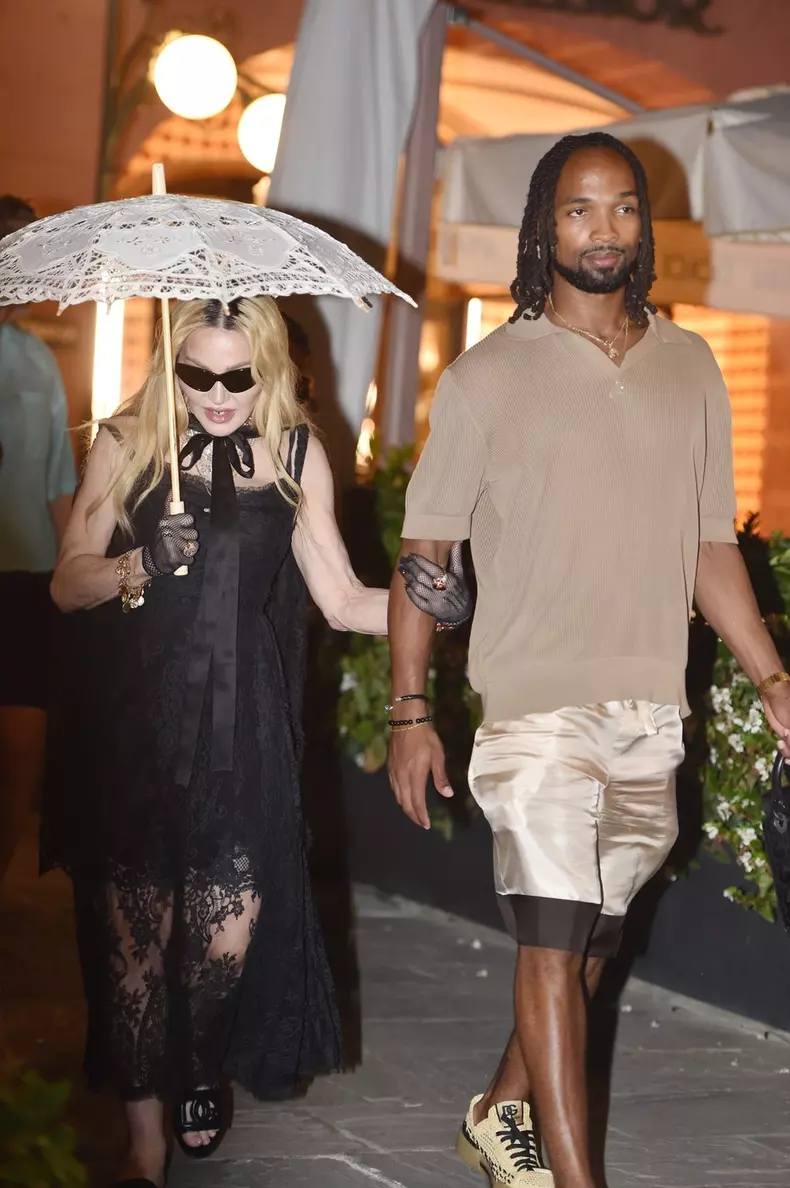 Pop legend Madonna shopping at Dolce & Gabbana with her rumoured new beau 28-year-old Akeem Morris while on holiday in Portofino ahead her 66th birthday celebrations
