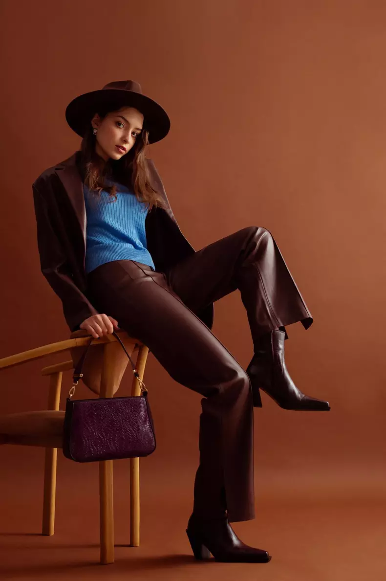 Fashionable,Confident,Woman,Wearing,Hat,,Blue,Jumper,,Faux,Leather,Suit