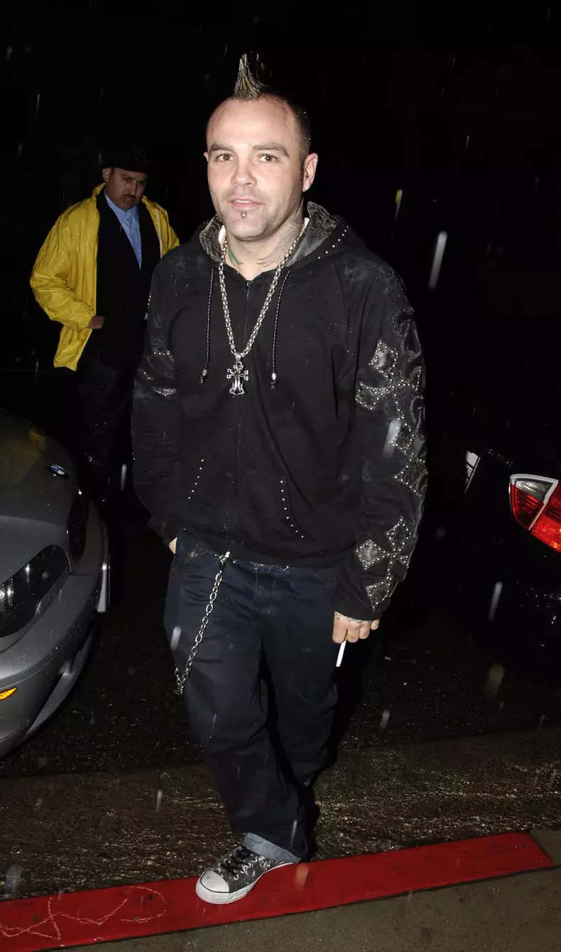 Crazytown frontman Seth Binzer, aka Shifty Shellshock, braves the bad weather for a night out at Goa nightclub in LA