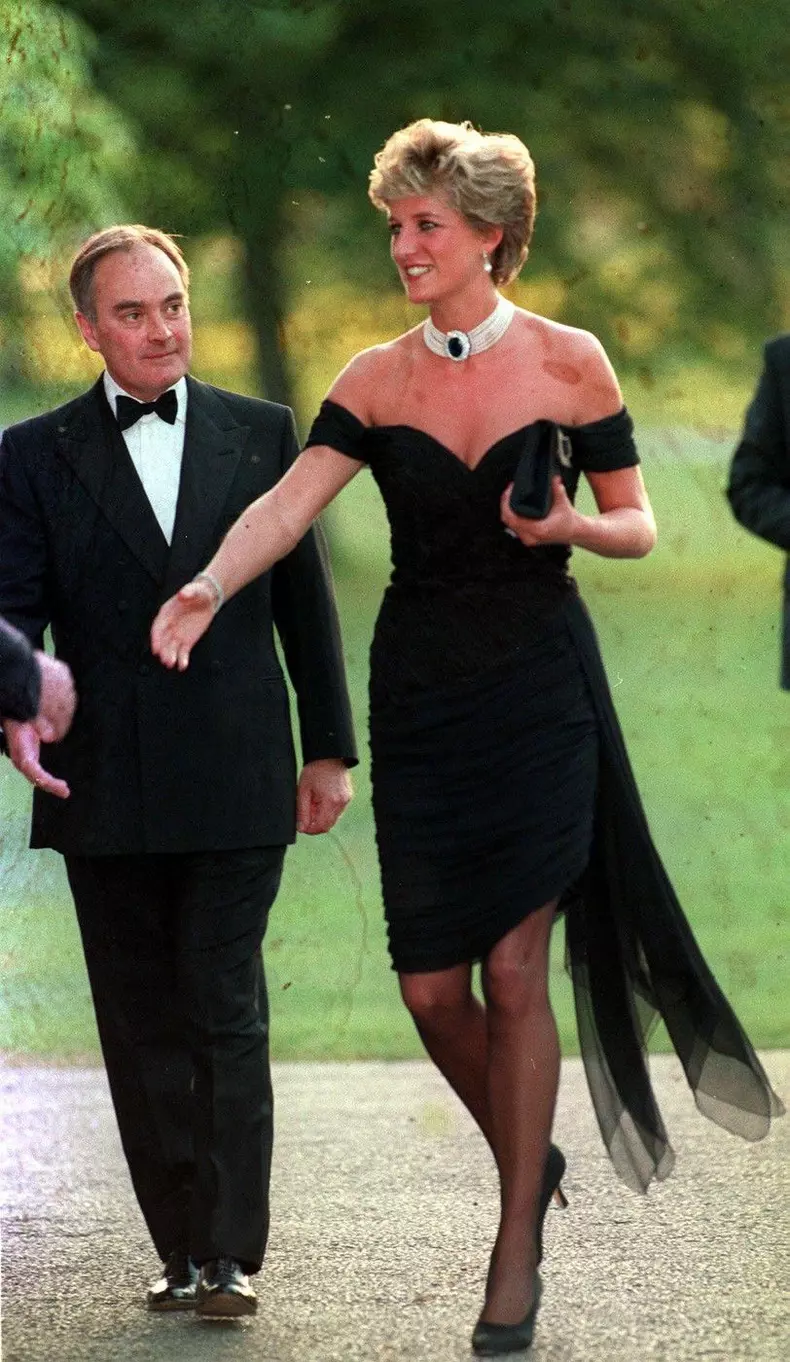 File photo dated 29/06/94 of Diana, Princess of Wales wearing a black pleated chiffon dress, with floating side panel, by Christina Stamboulian, during a party given at the Serpentine Gallery in London. A reproduction of Princess Diana's revenge dress, wh