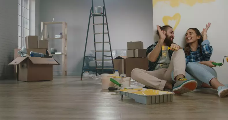 Newlywed,Caucasian,Couple,Are,Relaxing,During,Renovation,Of,Their,New