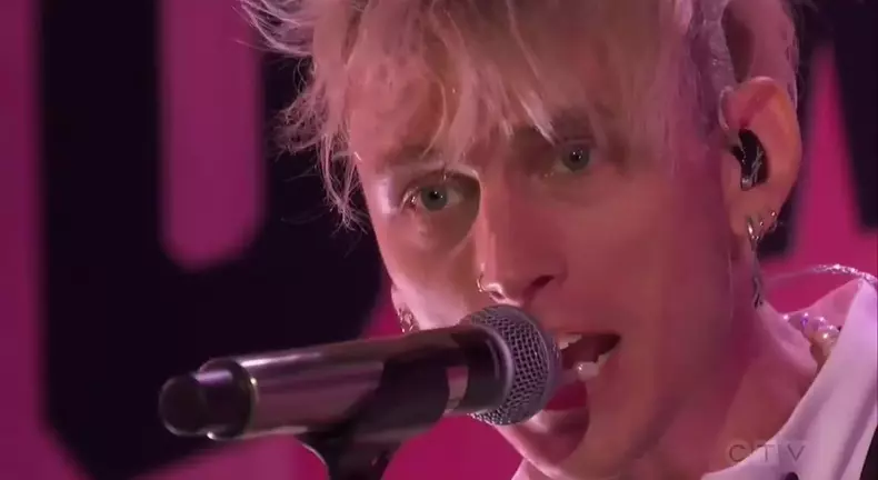 Megan Fox Introduces boyfriend Machine Gun Kelly's performance during AMAs, declaring: "We've all been under his spell."