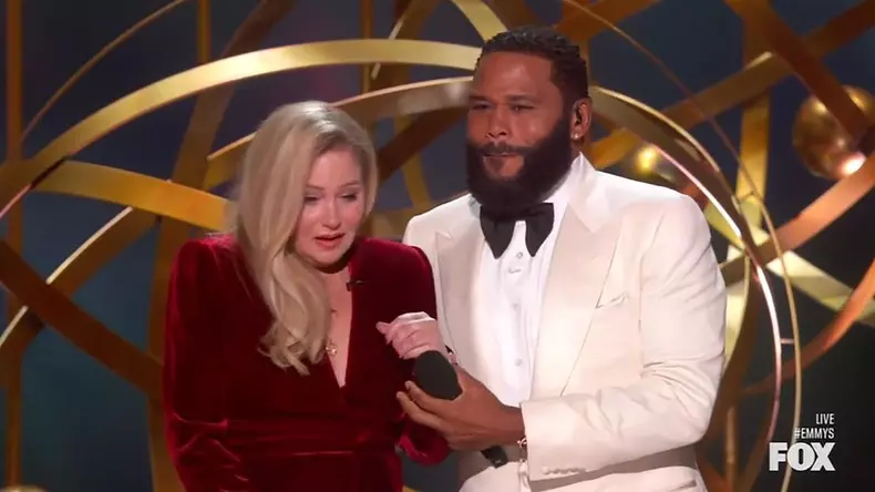Christina Applegate gets a standing ovation as she walks out on stage with a cane to present at the Emmy Awards