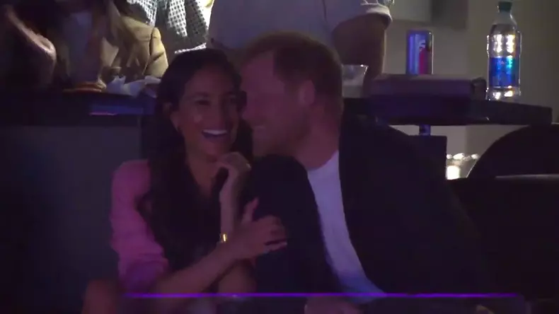Prince Harry and Meghan Markle laughing during kiss cam at the NBA basketball playoff game in Los Angeles
