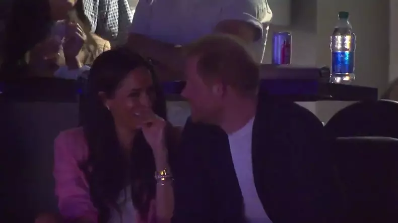 Prince Harry and Meghan Markle laughing during kiss cam at the NBA basketball playoff game in Los Angeles