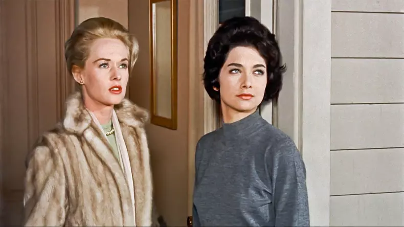 USA. Suzanne Pleshette , Tippi Hedren in a scene from the ©Universal Pictures movie: The Birds (1963).PLOT: A wealthy San Francisco socialite pursues a potential boyfriend to a small Northern California town that slowly takes a turn for the bizarre when