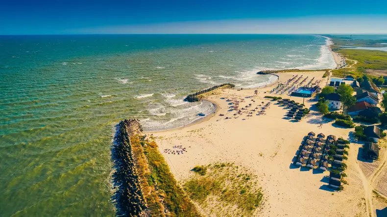 Aerial,View,Of,Beautiful,Colourful,Beach,At,Gura,Portitei,From