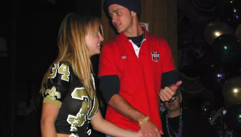 EXCLUSIVE: Britney Spears and Justin Timberlake watch Tom Brady's first Super Bowl in 2002 at Planet Hollywood NYC in these never-before-seen photographs.
