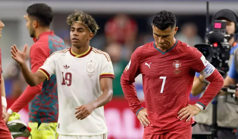Lamine Yamal of Spain celebrates while Cristiano Ronaldo of Portugal looks dejected after the FIFA World Cup 2026 Round Of 16 match between Portugal and Spain at Dallas Stadium on July 6, 2026 in Arlington, United States.