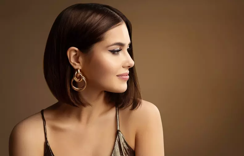 Beautiful,Woman,Profile,Portrait,With,Golden,Earring,Bob,Hair,Style