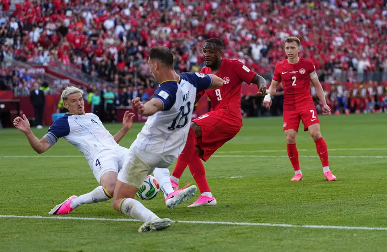 Toronto, Canada. 12th June, 2026. Cyle Larin (Canada) and Tarik Muharemovic (Bosnia And Herzegovina) battle for the ball during Canada and Bosnia and Herzegovina, FIFA World Cup 2026, at Toronto Stadium in Toronto, Canada. Kim Price/CSM/Alamy Live News