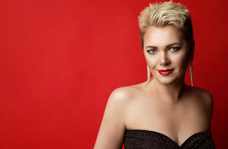Woman,Beauty,With,Blond,Short,Hairstyle,Over,Red,Background.,Smiling