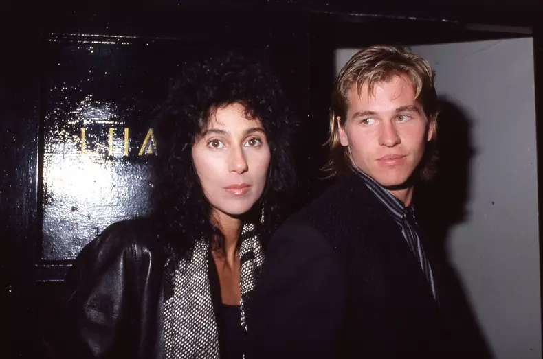 **FILE PHOTO** Val Kilmer Has Passed Away.  Cher and Val Kilmer at a Bette Midler Video Party on January 9, 1984. Credit: Ralph Dominguez/MediaPunch