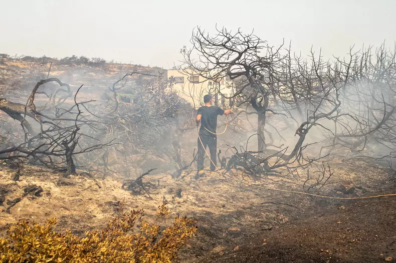 Local people and tourists have been evacuated from area after wild fires broke out on the island of Rhodes, Greece