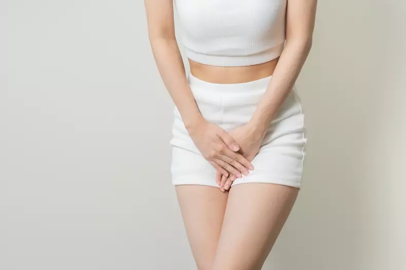 Vaginal,,Urinary,Incontinence.,Pain,Asian,Young,Woman,Hand,Holding,Crotch