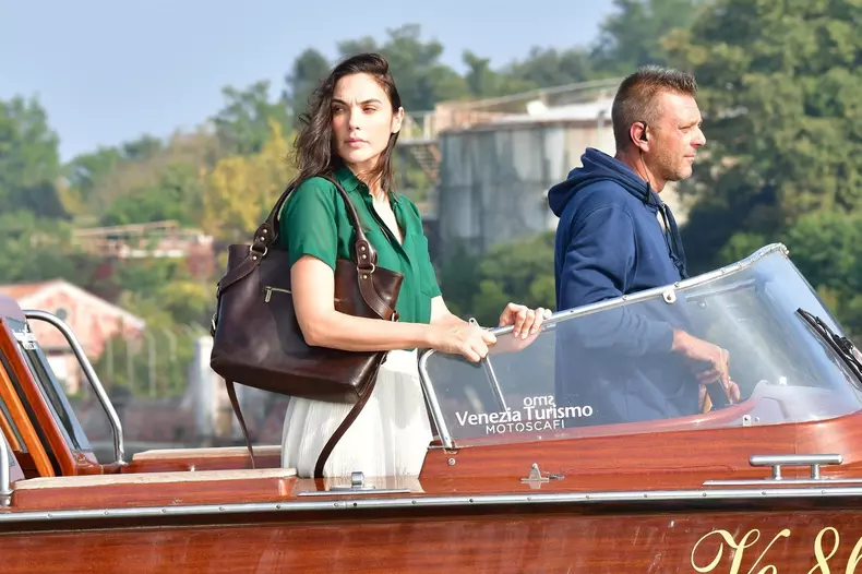 *EXCLUSIVE* Amidst the horrific war between Israel and Hamas, Israeli actress Gal Gadot shoots water taxi scenes in Venice on the set of Julian Schnabel's "In the Hand of Dante"