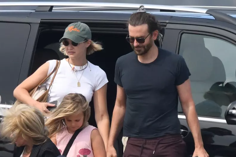 *PREMIUM-EXCLUSIVE* MUST CALL FOR PRICING BEFORE USAGE  - American actor Bradley Cooper pictured with his daughter and his Model girlfriend Gigi Hadid as they arrive in Sardinia for their summer Holidays.