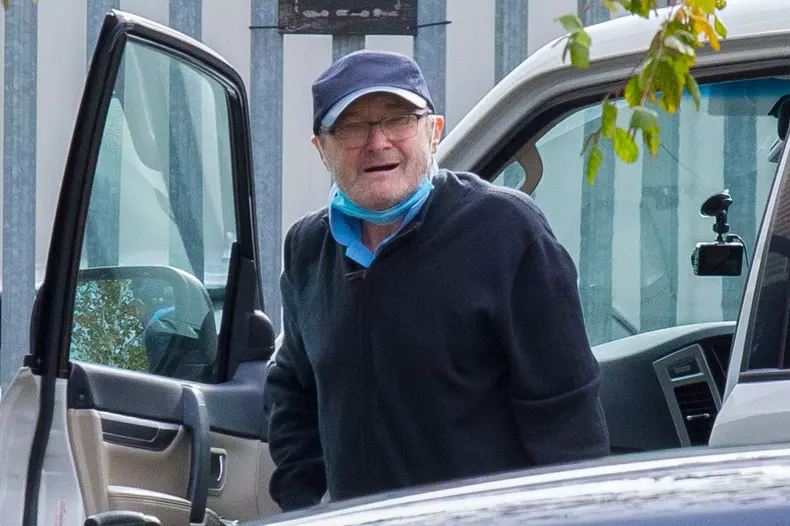 EXCLUSIVE: Phil Collins is helped into a wheelchair amid his ongoing battle to evict ex-wife Orianne Cevey from his $32 million Miami mansion