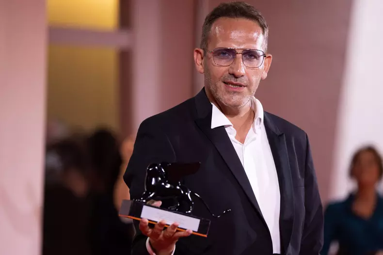 News - 2024 Winners Photocall - The 81st Venice International Film Festival Bogdan Muresanu poses with the Best Film Awa