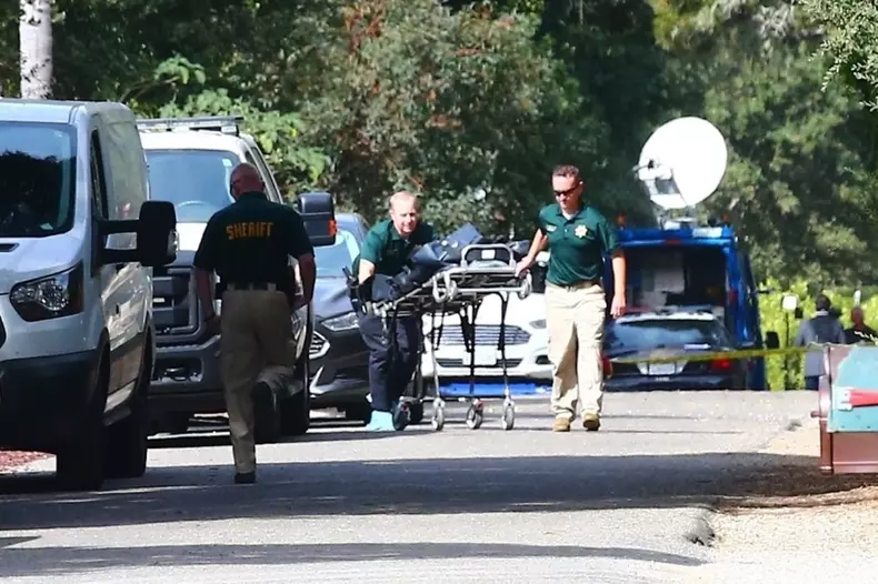 A body is taken away from Ron Ely's Santa Barbara home