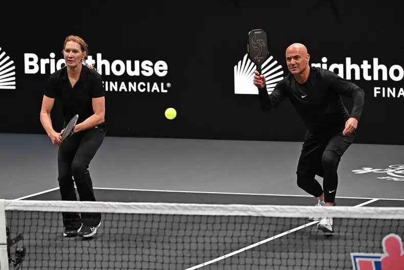 HOLLYWOOD FL - FEBRUARY 04: Andre Agassi and Steffi Graff play during The Pickleball Slam 2 at Hard Rock Live held at th