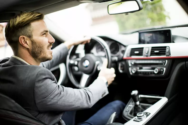 Young,Man,Driving,In,The,Modern,Car