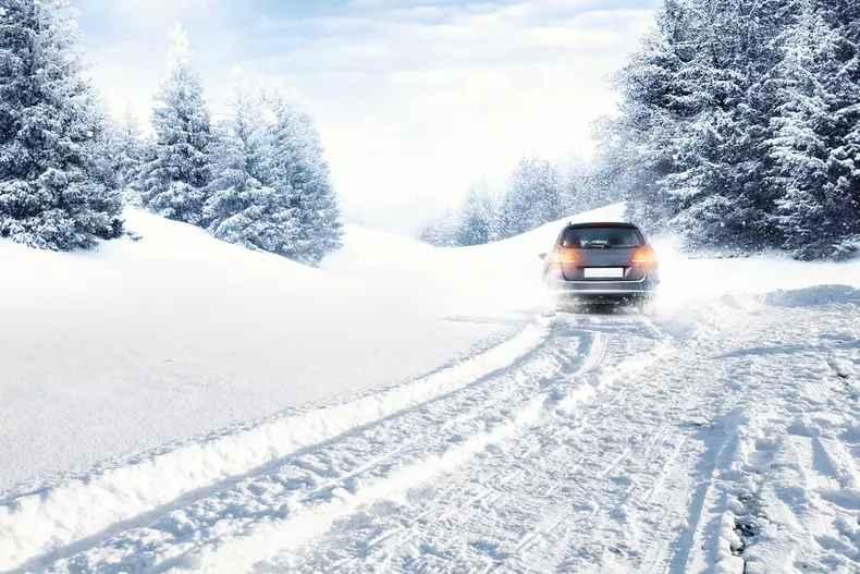 Fast,Car,On,Winter,Road,And,Snow,Splash
