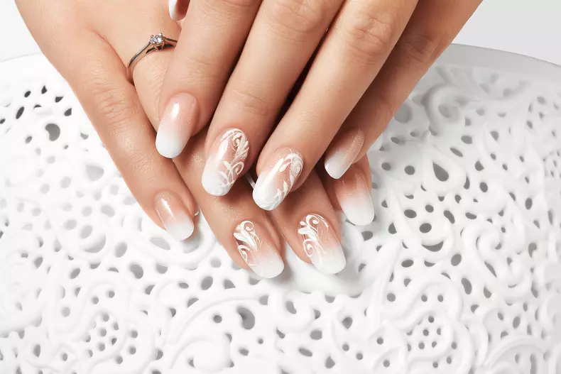 White drawing female nails.