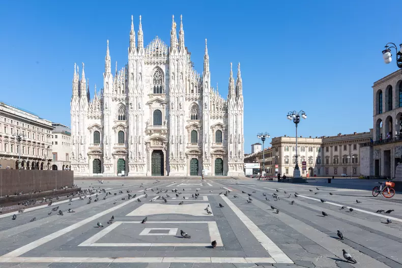 Italy: Coronavirus Covid 19 emergency. Empty Piazza Duomo (cathedral square) in Milan
