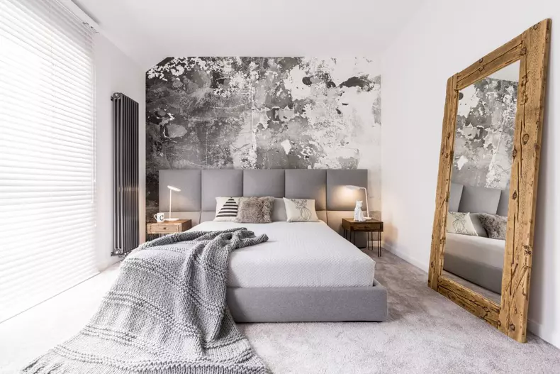 Long,Blanket,Lying,On,A,Double,Bed,In,A,Rectangular,