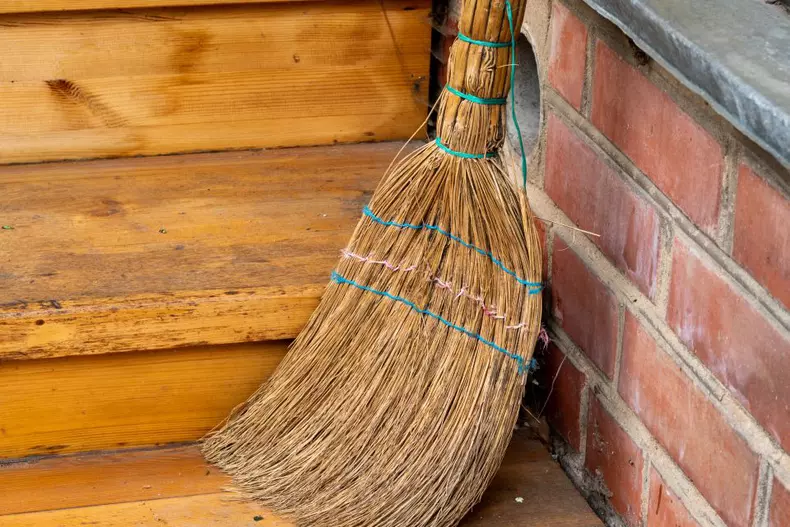Old,Broom,On,The,Threshold,Of,The,House.,Close,Up.