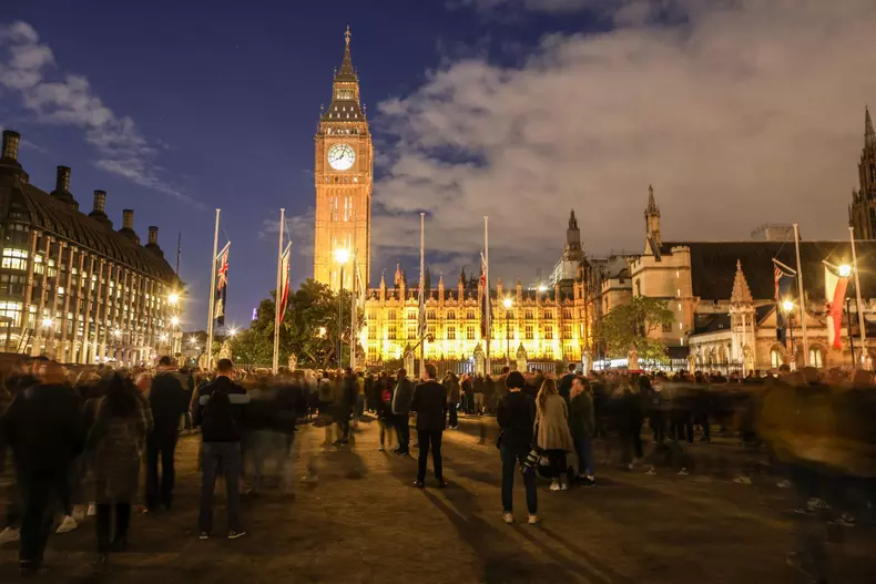 People attend a National Moment of Reflection near BigBen Tower - London