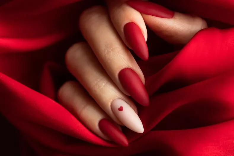 Matte,Red,Nails,With,Small,Red,Heart,On,Beige,Colour