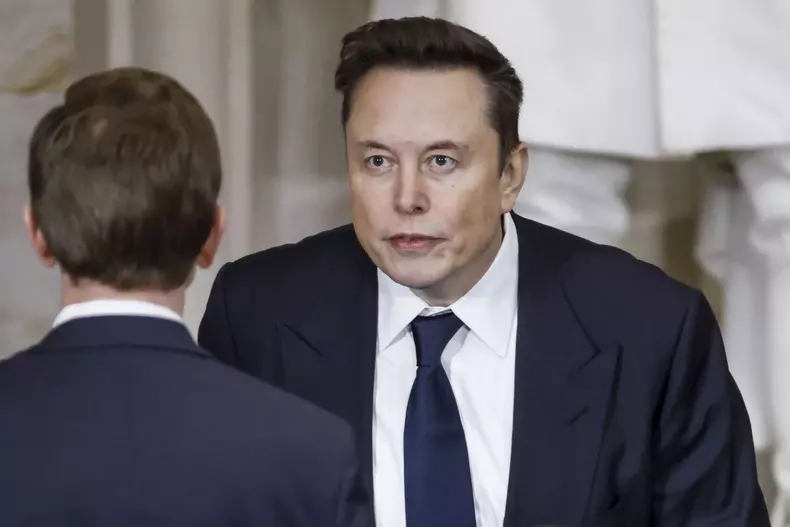 Elon Musk Holds His Phone At Trump Inauguration - DC
