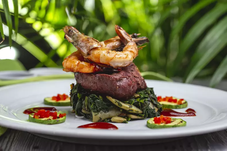 fried meat with prawns zuccihni spinach mushroom side view