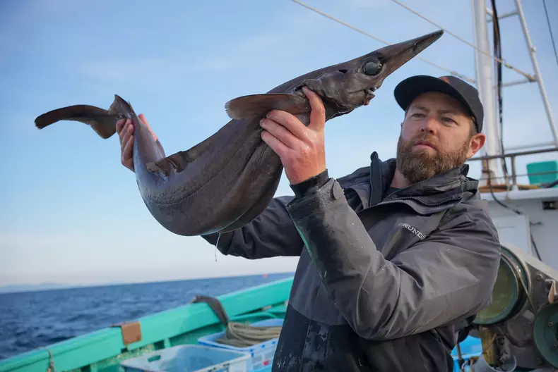 Forrest Galante holding a deep sea species of shark