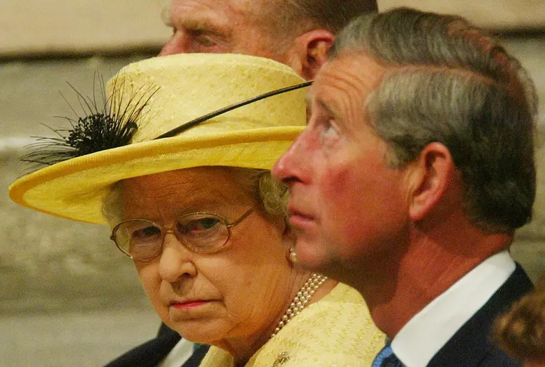 QUEEN ELIZABETH II LOOKS OVER AS FIRST IN LINE FOR THE THRONE, PRINCE CHARLES LOOKS UP IN WESTMINSTER ABBEY DURING THE CEREMONY TO MARK THE 50TH ANNIVERSARY OF THE CORONATION IN LONDON