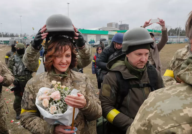 Ukrainian territorial defense fighters tie the knot amid Russian military operation