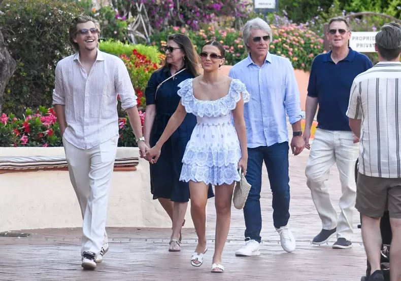 *PREMIUM-EXCLUSIVE* *MUST CALL FOR PRICING* Recently married 'Stranger Things' star Millie Bobby Brown and her new husband, the American model and actor Jake Bongiovi spotted taking a family stroll around the famous Porto Cervo square during their family