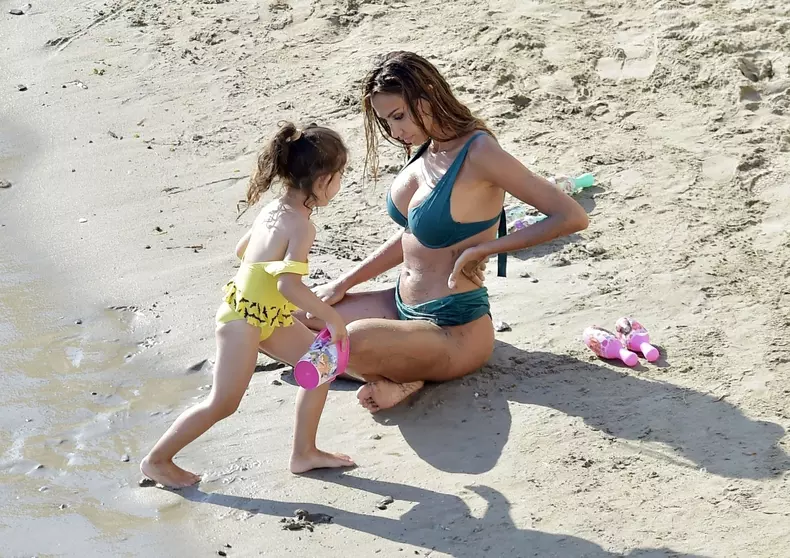 *EXCLUSIVE* Sexy Romanian actress and model Madalina Ghenea is spotted on holiday as she hits the beach with daughter Charlotte and friends out at Sestri Levante in Portofino.