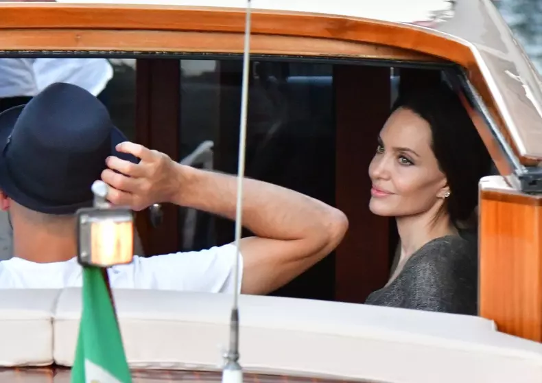 The American Actress Angelina Jolie spotted in the city of love and heads to a restaurant via a taxi boat in Venice.