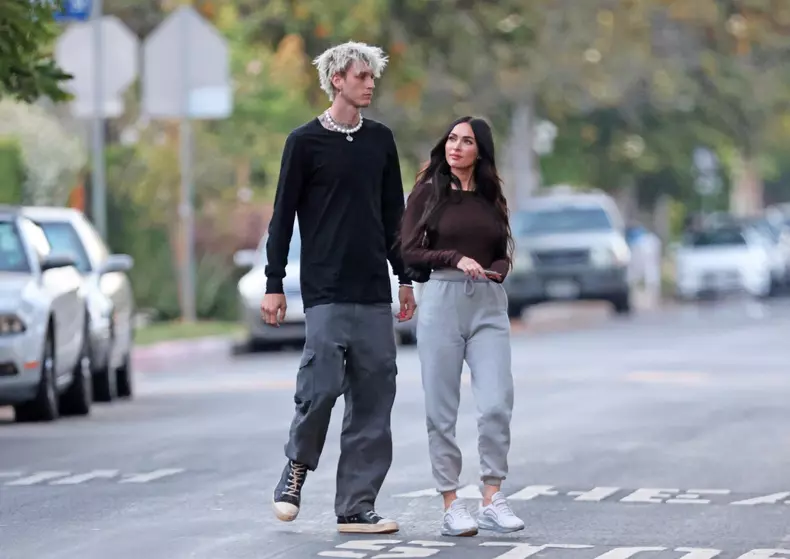 *EXCLUSIVE*  Megan Fox and Machine Gun Kelly pack on the PDA while attending a graduation in Sherman Oaks!